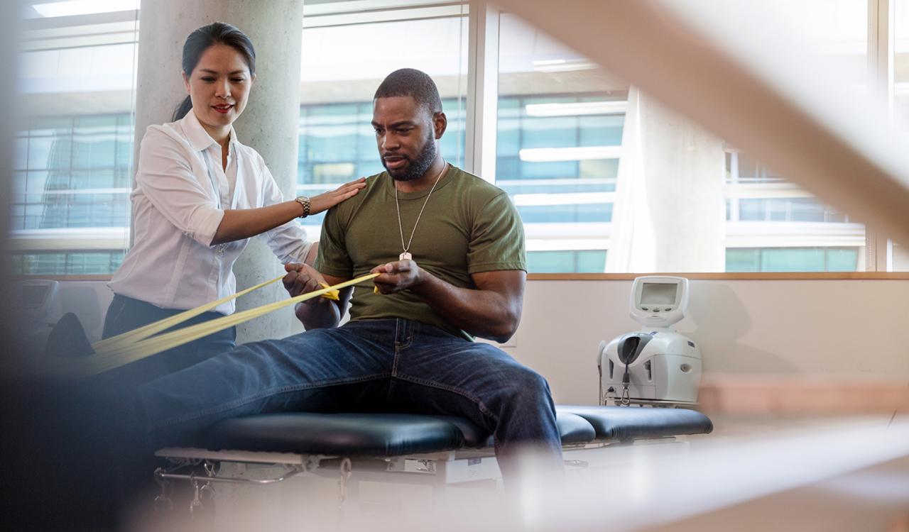 A care provider working with a patient.