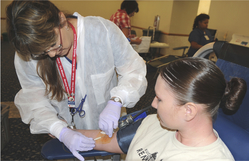 lab technician checking patient