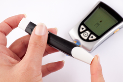 diabetes blood sugar test on finger