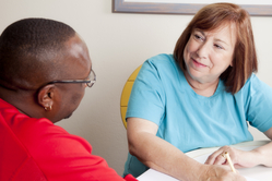 social worker talking to patient