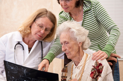 doctor overseeing woman explain to her mother about healthcare proxy