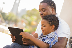 Man reading to boy