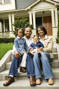 family portrait on front steps of home