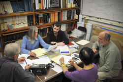 co-workers sitting around a table working