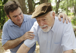 younger man comforting older man