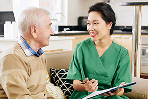 Older man with talking with a clinician