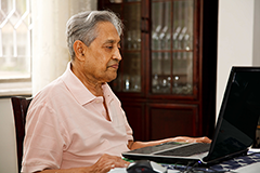 man looking at a computer