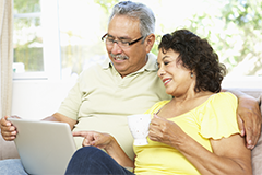 older couple looking at a computer