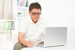 man looking at a computer