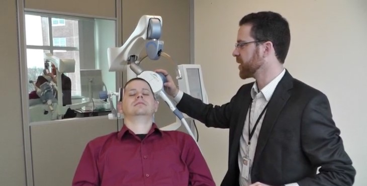 A Veteran being treated with TMS by Dr. Noah Philip.