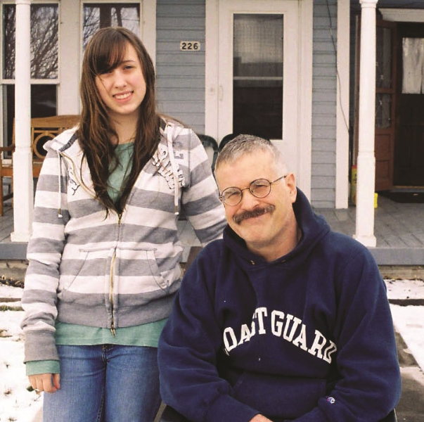 Ivan Nance standing with his daughter