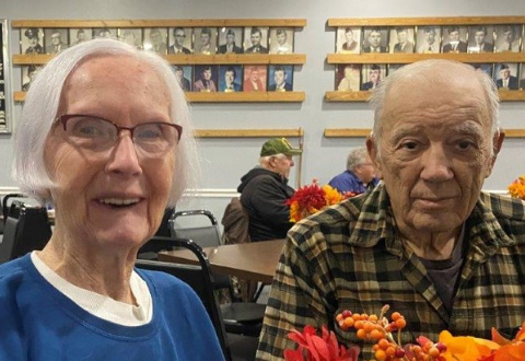 Couple sitting at a table eating