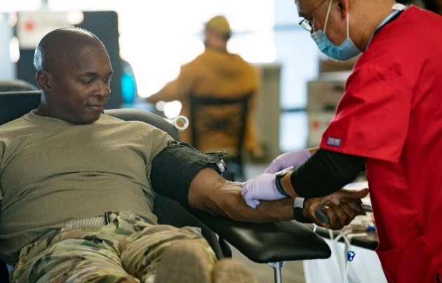 Clinician checking Veterans vital signs.