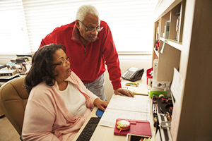 older couple looking at the computer