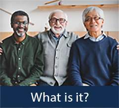 Three elderly men sitting together and smiling.