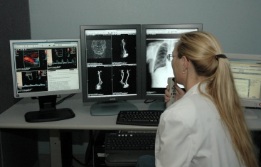 Photo: Jennifer Alcala, MD, reading at a VistARad diagnostic workstation. Photo courtesy of Abner Reese, Tucson VAMC.