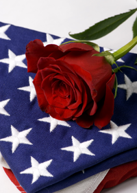 Folded flag with red rose on top